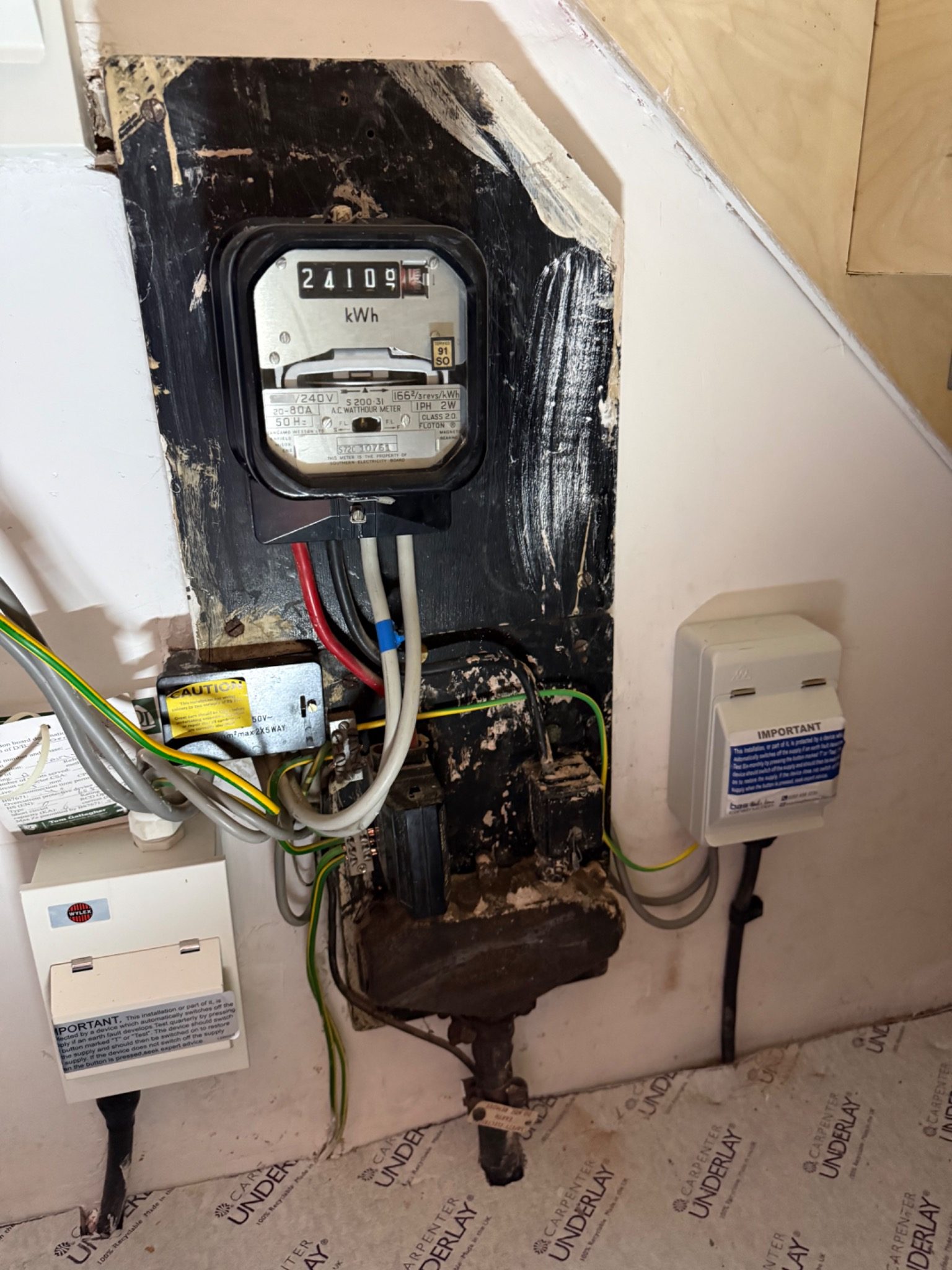 Existing electricity meter and supply equipment assessed before a Pod Point EV charger installation in Hillingdon